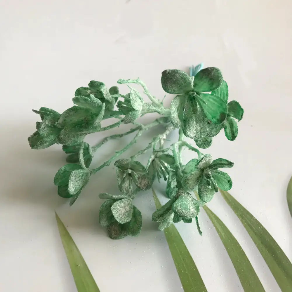 A cluster of green artificial plants hydrangea flowers with glittery frost finish for wedding and home decor by DecorBites artificial plants