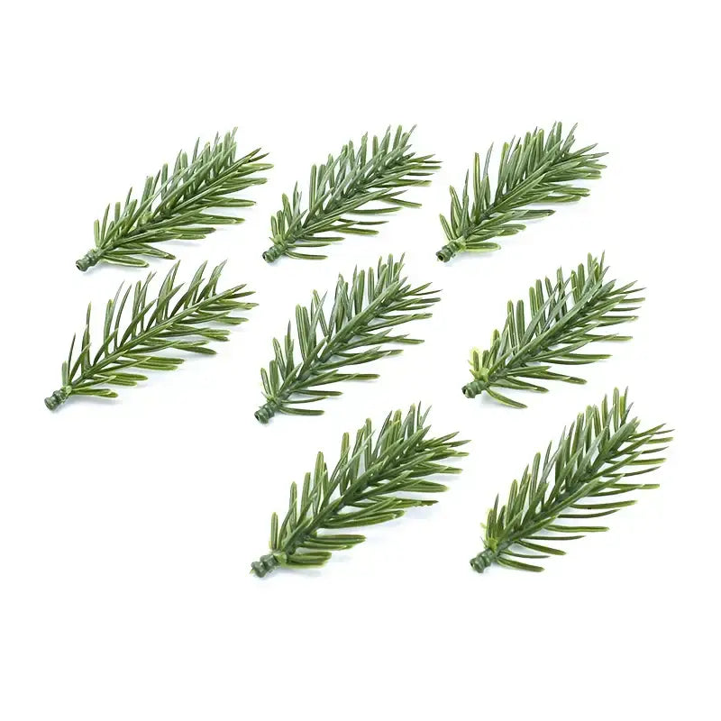 Green artificial plants pine branches by decorbites made of plastic with realistic needle texture for home decor use