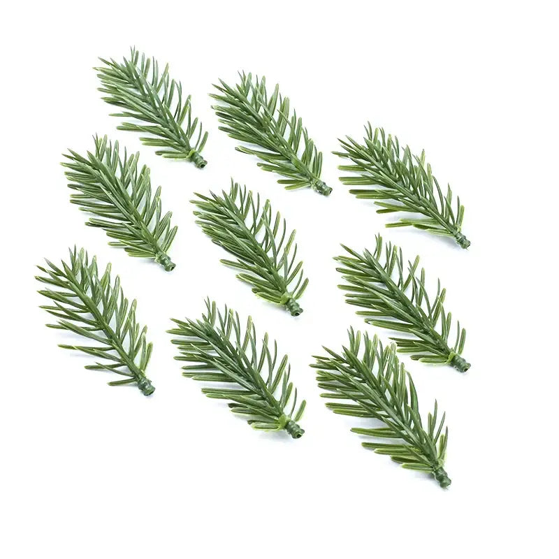 Green artificial pine sprigs from decorbites artificial plants made of plastic with realistic needle texture for decor use
