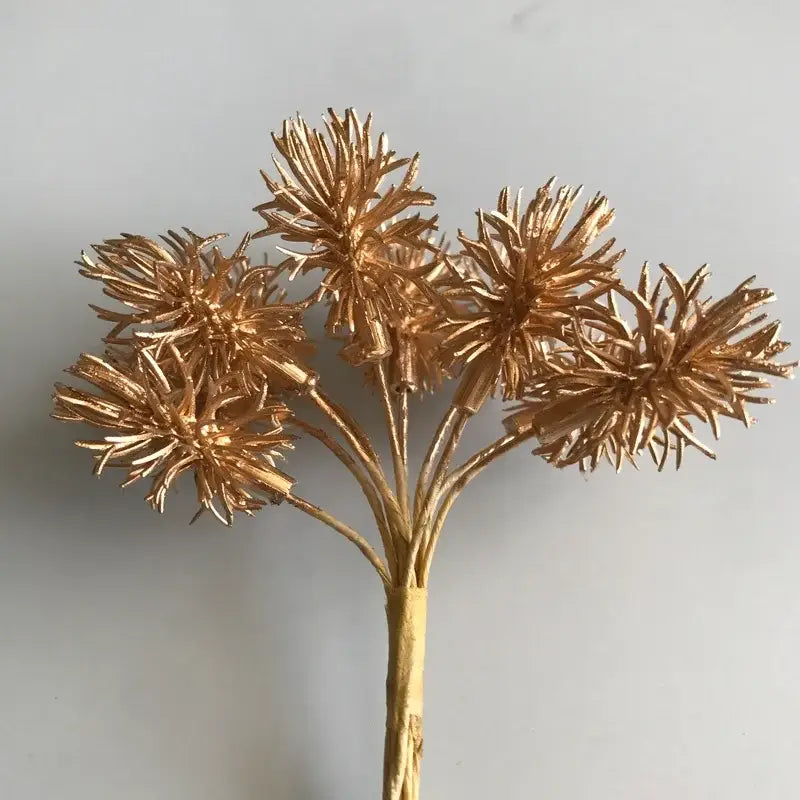 Golden metallic artificial flower with spiky petals and slender stem from decorbites artificial plants set for decor