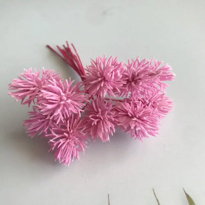 A cluster of pink spiky artificial plants with textured petals and thin stems from decorbites artificial plants set