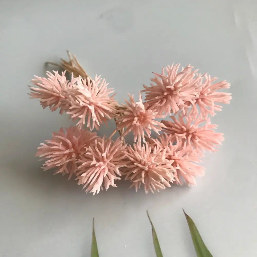 A cluster of delicate light pink dried artificial plants tied with natural twine from decorbites artificial plants set