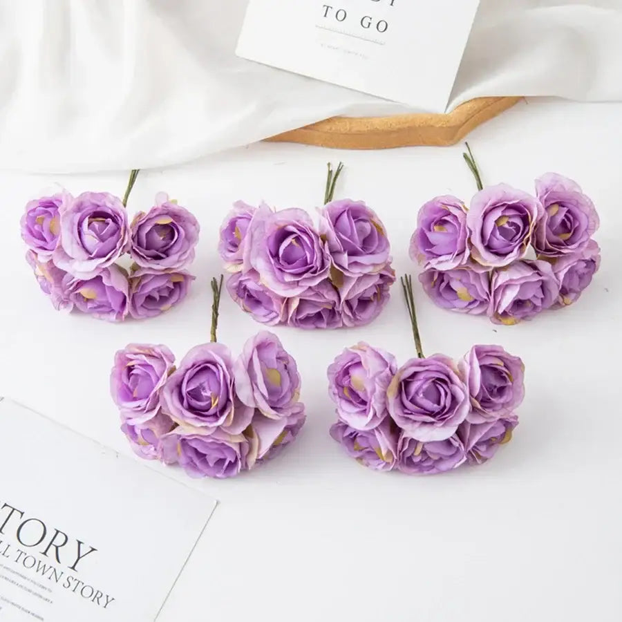 Decorbites artificial rose bouquet featuring purple clustered petals with gold accents for home decor and weddings