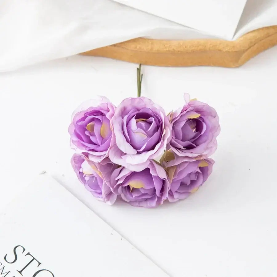 A decorbites artificial rose bouquet featuring delicate lavender petals with yellow centers for home and wedding decor