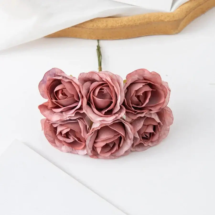 A decorbites artificial rose bouquet featuring five soft pink roses with layered petals for home and wedding decor