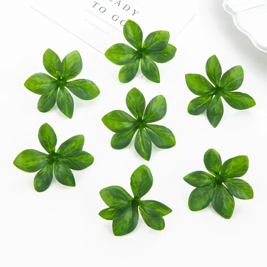 Green artificial rose leaf stems by decorbites made of glossy plastic with subtle veining for DIY wreaths and home decor
