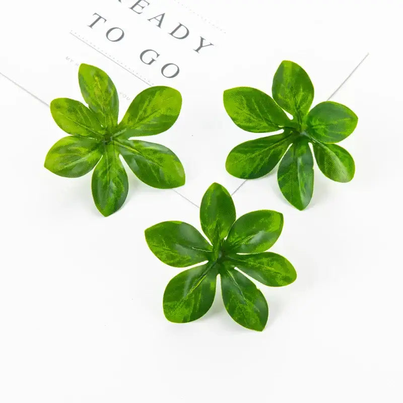 Three green decorbites artificial rose leaf stems with glossy veined surfaces for diy wreaths and home decor