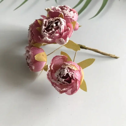Decorbites artificial roses bridal bouquet featuring pink fabric peonies with gold leaf accents and textured finish