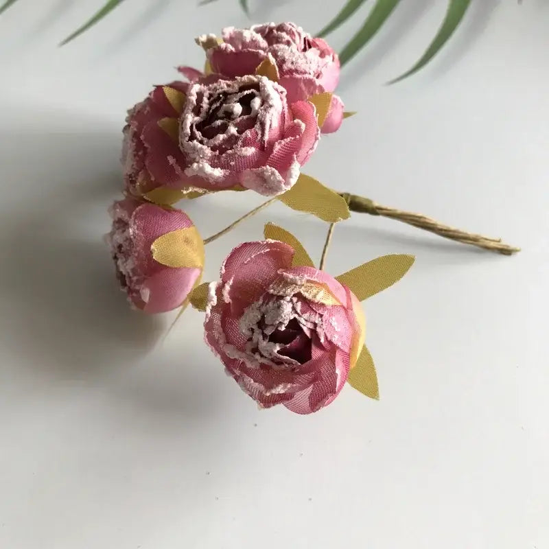 Decorbites artificial roses bridal bouquet featuring pink fabric peonies with gold leaf accents and textured finish