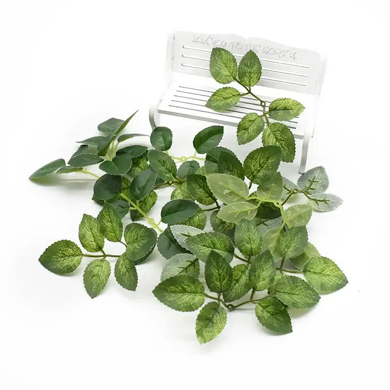 Artificial green leaf vine with realistic veining and varying shades of green for decorbites artificial roses wreath silk flowers
