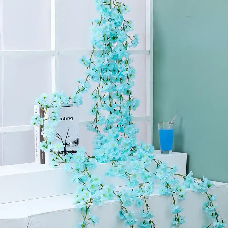 DecorBites artificial sakura light blue flowers vine with small blossoms and green stems for wedding decoration