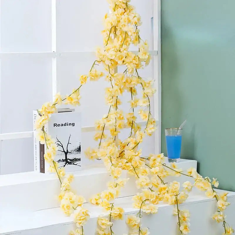 DecorBites™ artificial sakura flowers vine featuring delicate cascading yellow cherry blossoms with slender green stems