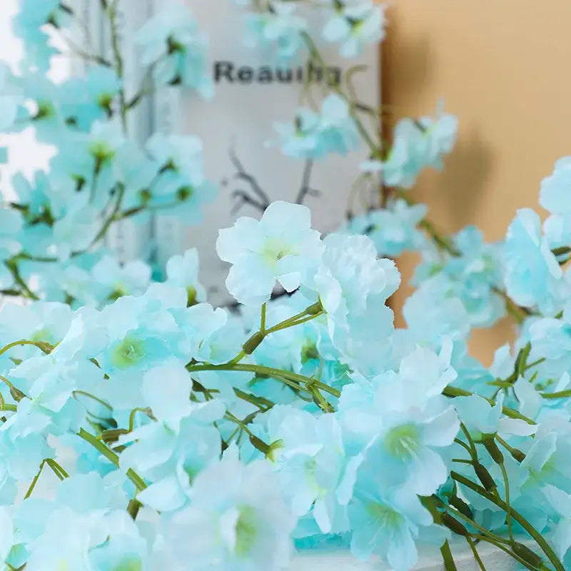 Decorbites artificial sakura light blue sakura flowers vine with soft petals and green stems for wedding decoration
