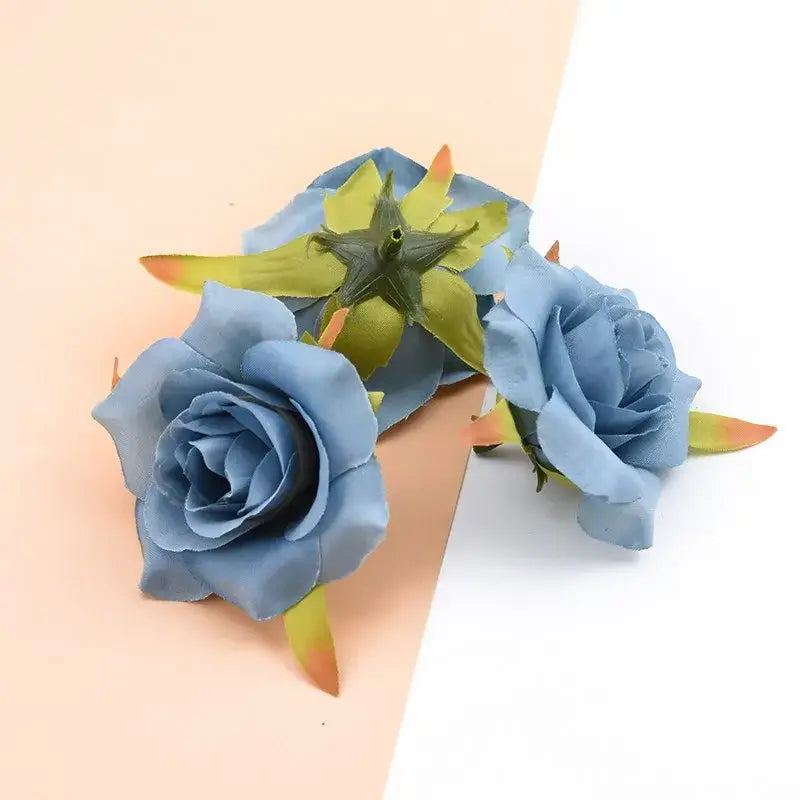 Blue decorbites artificial silk roses with green and orange tipped leaves for wedding and home decor use
