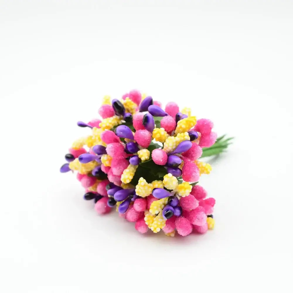 A vibrant bouquet of decorbites artificial stamen flowers in pink purple and yellow with a textured fuzzy surface