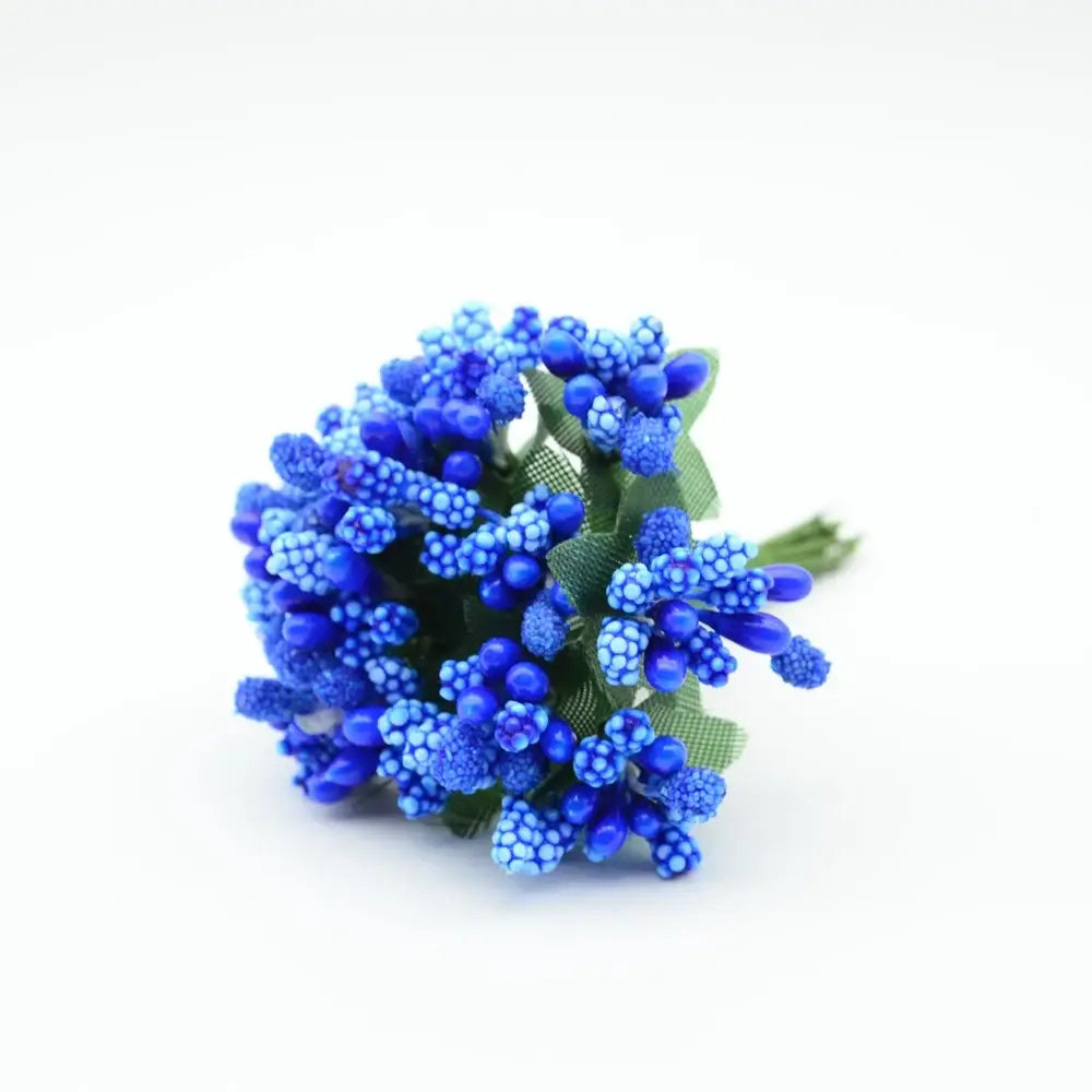 A vibrant blue decorbites artificial stamen flower bouquet with textured petals and green fabric leaves for home decor