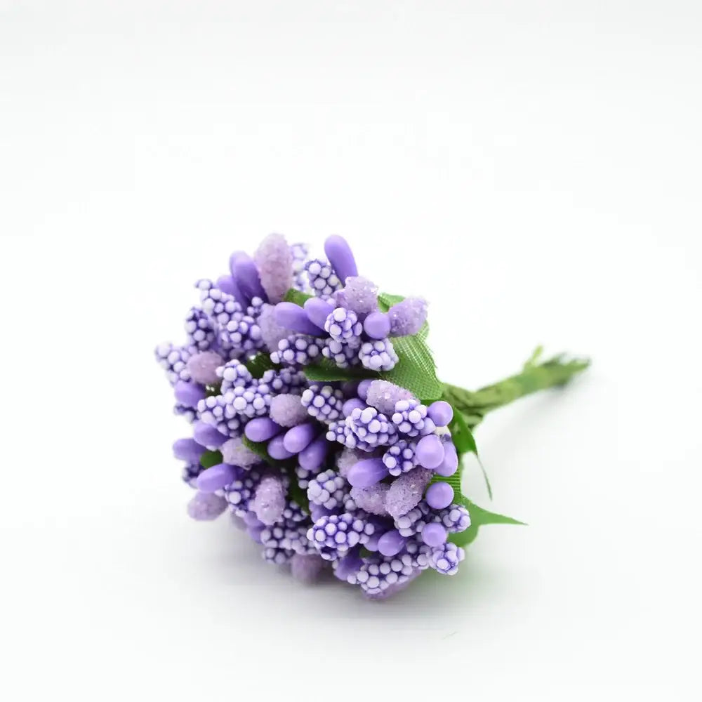 A delicate cluster of decorbites artificial stamen flowers with textured purple bead-like petals for home wedding decor