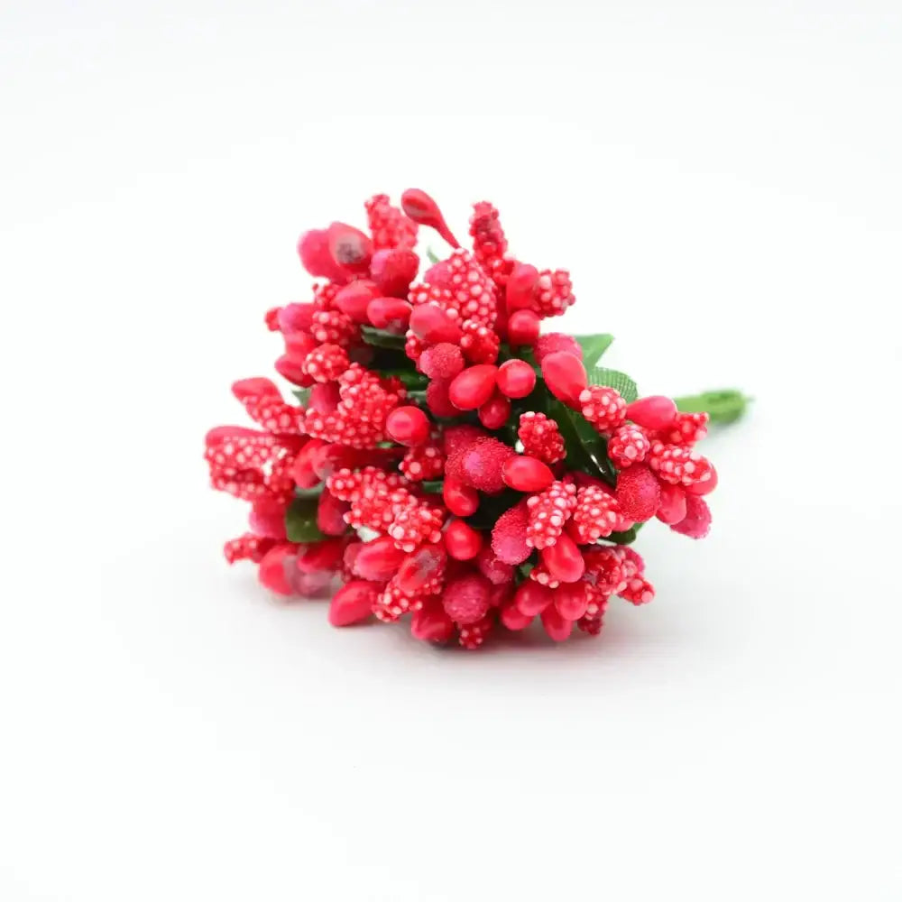 A cluster of vibrant red decorbites artificial stamen flowers with textured berries and small green leaves for home wedding decor