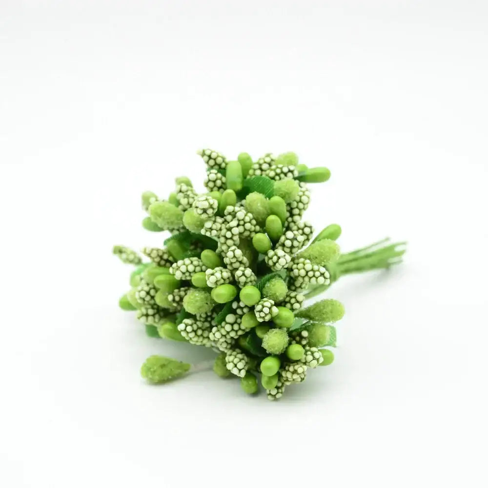 A delicate cluster of green decorbites artificial stamen flowers with frosted textured leaves for home wedding decor