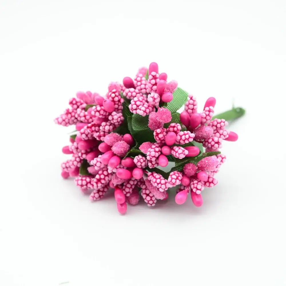 A cluster of vibrant pink decorbites artificial stamen flowers with textured bead petals and green fabric leaves for decor