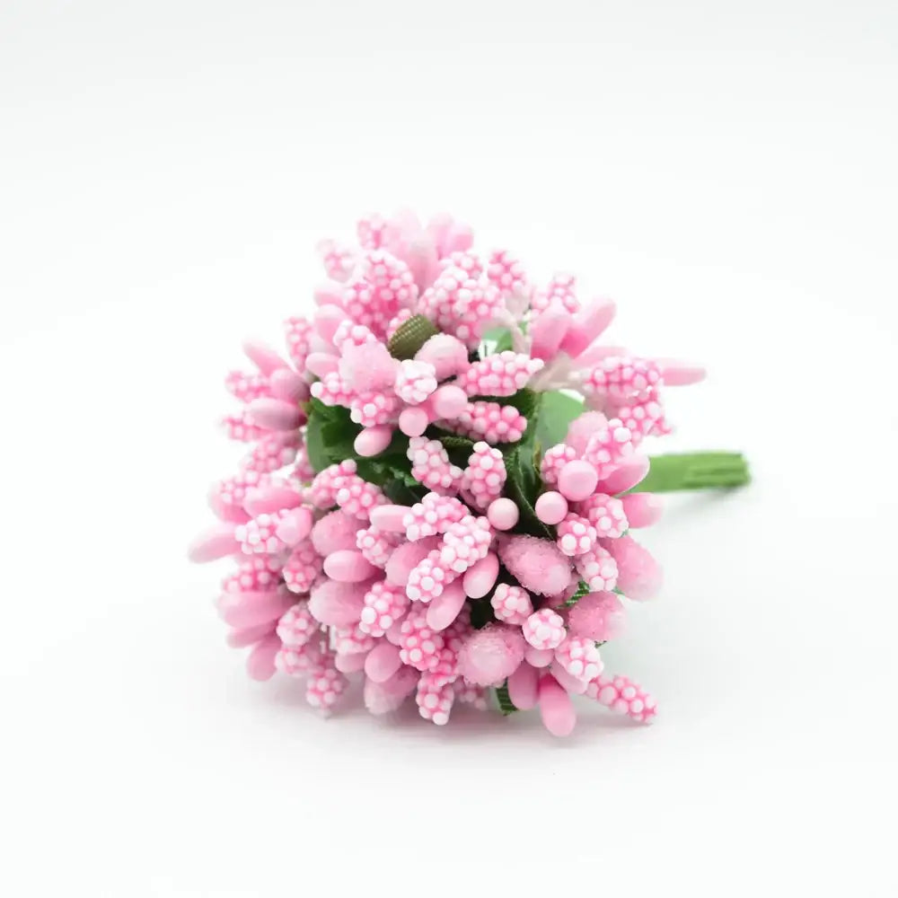 A delicate cluster of pink decorbites artificial stamen flowers with textured bead-like petals and green stems for decor