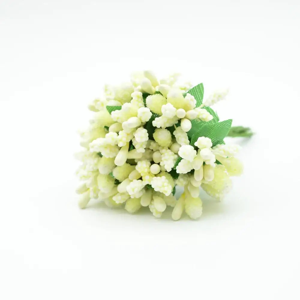 A delicate cluster of pale cream decorbites artificial stamen flowers with green ribbon leaves for home wedding decor