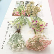 A decorbites™ artificial succulent tree featuring delicate pastel pink lavender and cream flowers with green foliage for home décor