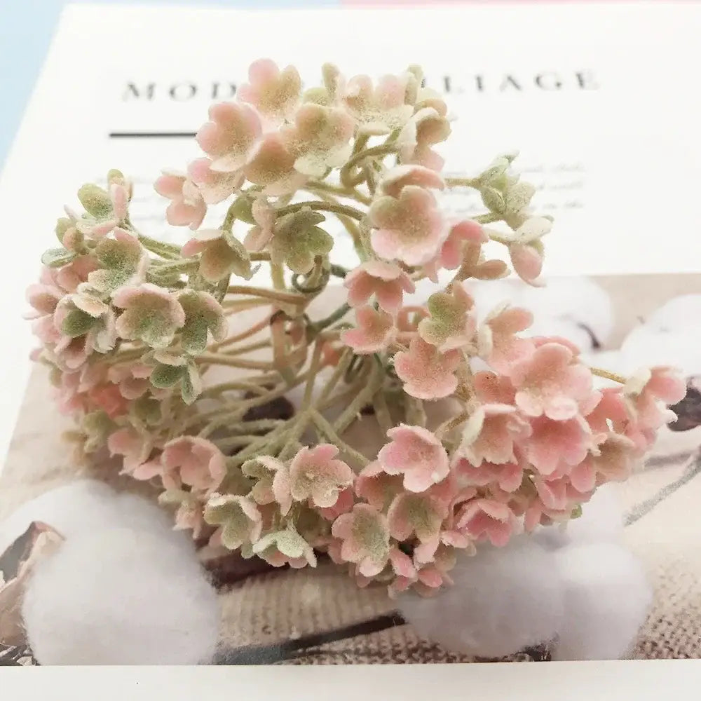 A delicate cluster of pink and green artificial succulents with a soft frosted texture in a DecorBites™ succulent tree