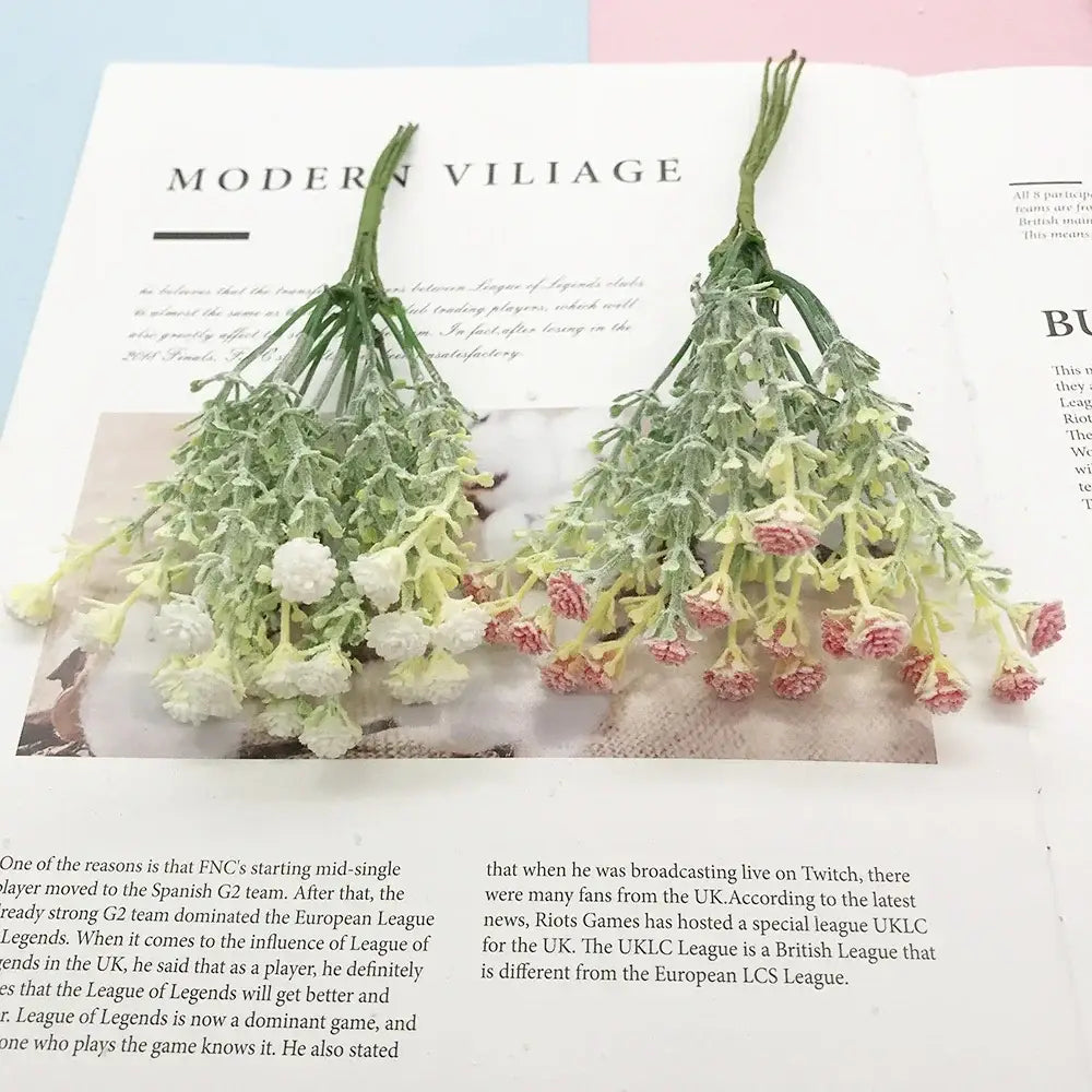 Decorbites™ artificial succulent tree features two bundles of delicate green stems with small white and pink blossoms