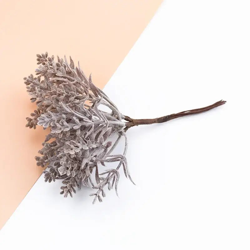 Frosty gray artificial lavender sprig with textured foliage and dark brown stem in decorbites artificial water grass vase