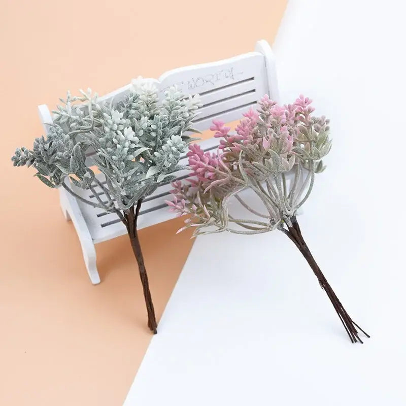 Two decorbites artificial water grass bouquets with frosted silver-green and pink-tipped leaves in water grass vases