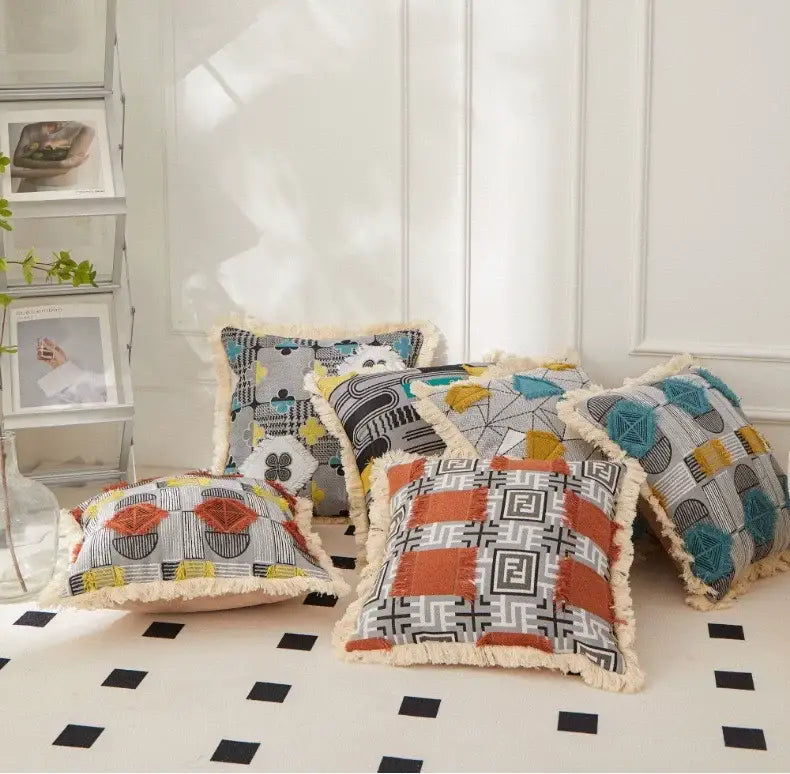 A collection of decorbites artistic 45x45 handmade cushion covers with geometric patterns and cream-colored fringe