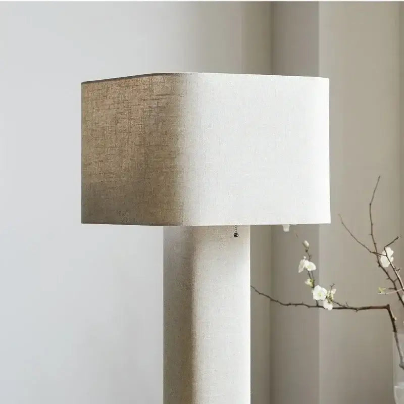 Modern rectangular decorbites artistic floor lamp with two-toned beige and white linen shade and textured fabric base