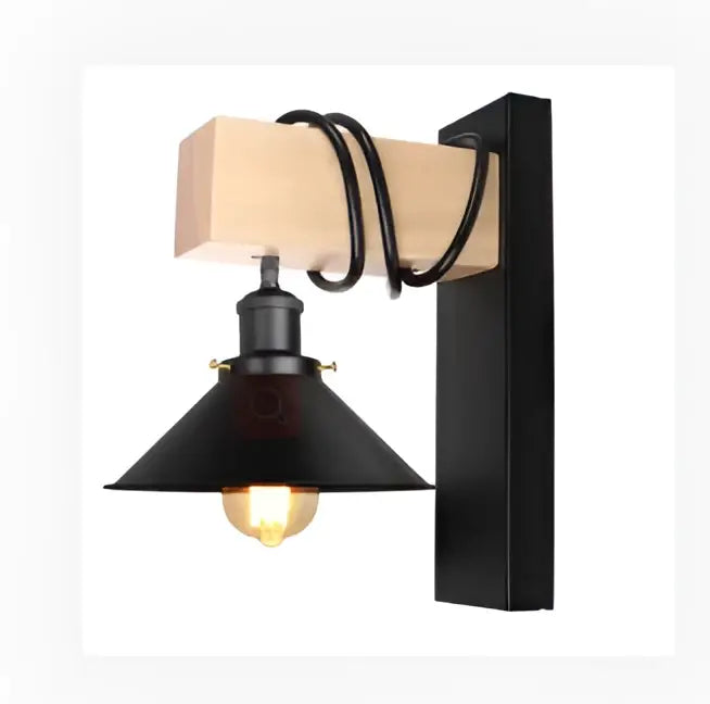 Black metal wall lamp with wooden beam accent and coiled black cord by DecorBites artistic metal iron