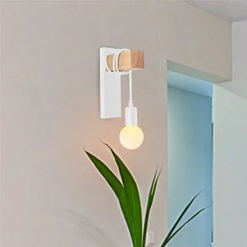 Minimalist wall lamp by DecorBites artistic metal iron with white base, wood accent, and frosted glass bulb for bedroom use