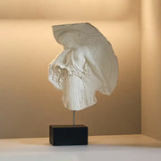 White marble decorbites artistic venus relief sculpture of a draped goddess figure on black rectangular base for home decor