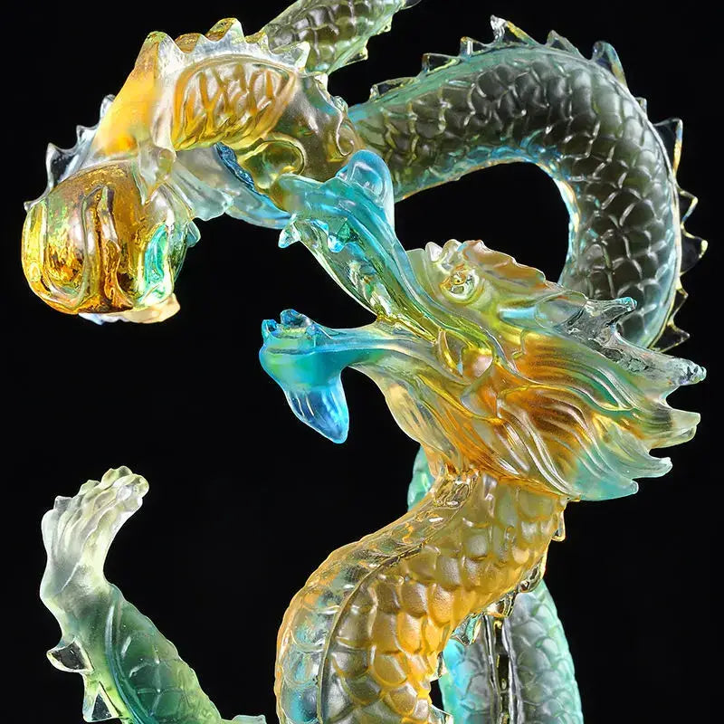 DecorBites ascending dragon feng shui ornament is a translucent iridescent glass sculpture in amber teal and blue