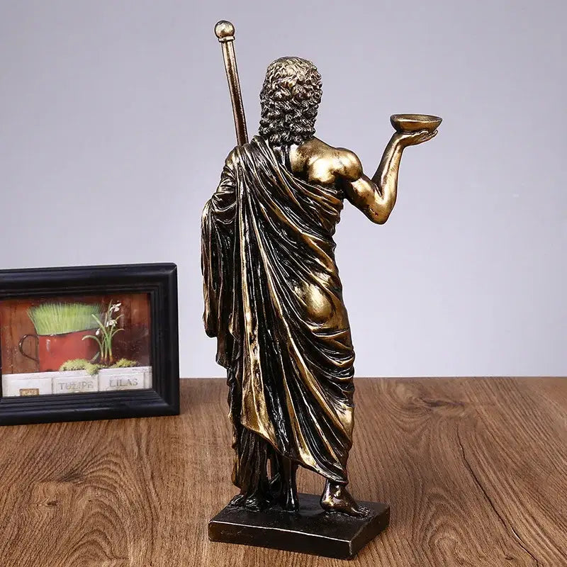 Bronze-colored resin asclepius mini statue depicting a muscular bearded figure with bowl and staff for home decor