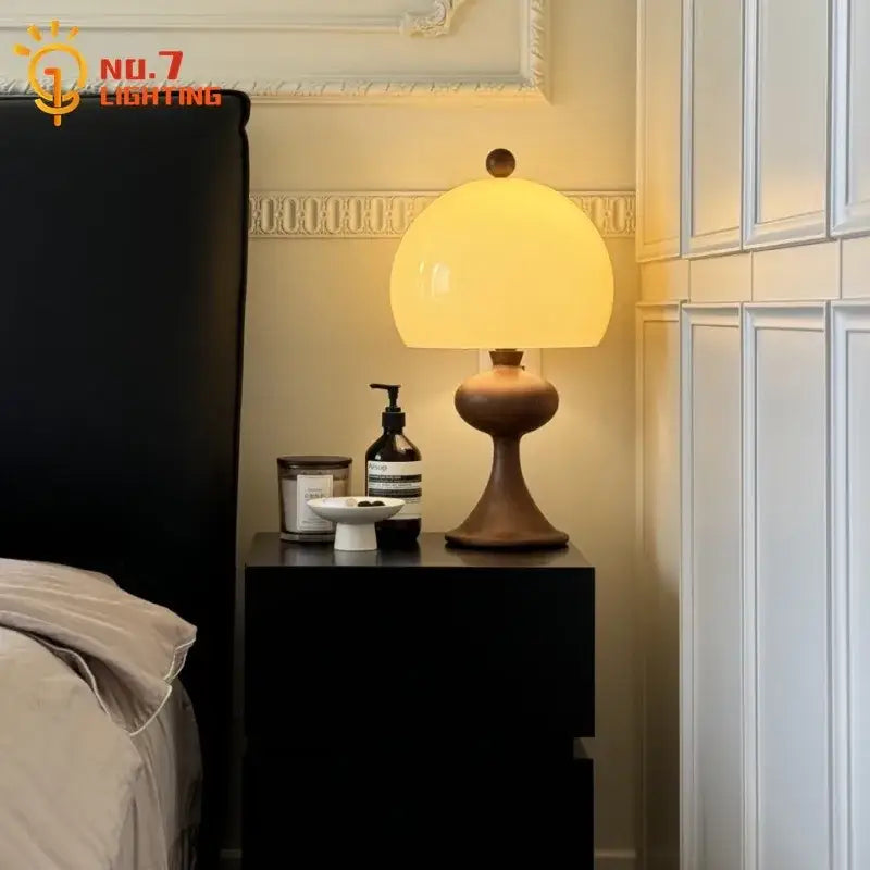 Warm yellow glass dome table lamp with dark brown ceramic base from decorbites ash wood bubble collection