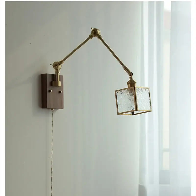 Brass-finished decorbites ash wood led wall lamp with adjustable arm and textured glass cube shade on wooden base