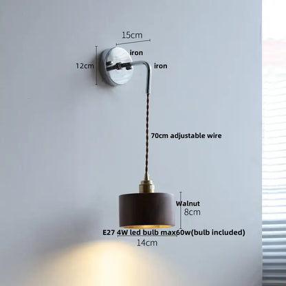 A sleek decorbites ash wood led wall light with a polished iron base and walnut-finished cylindrical shade for bedside use