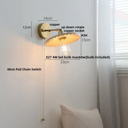 Copper wall sconce with scalloped translucent amber glass shade and exposed edison bulb in decorbites ash wood led style