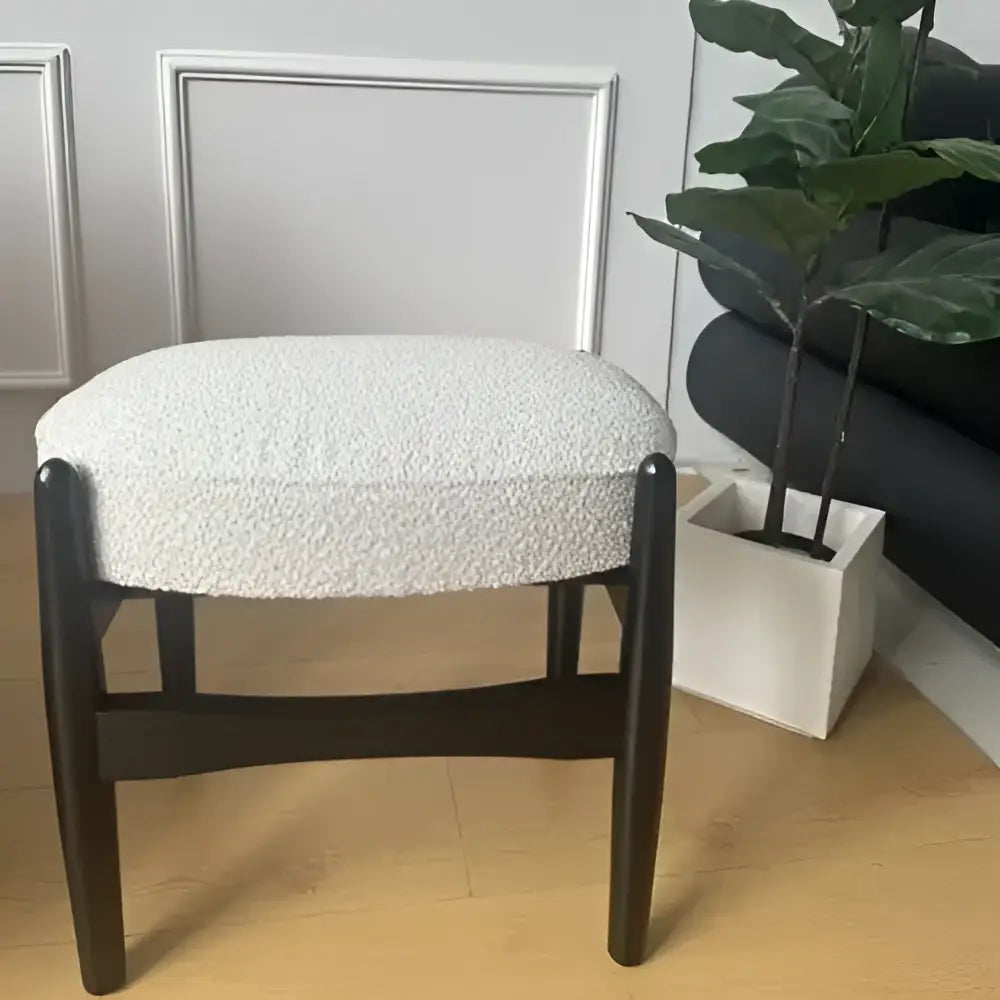 Modern decorbites ash wood makeup bench with textured off-white upholstered seat and dark wooden legs for small spaces