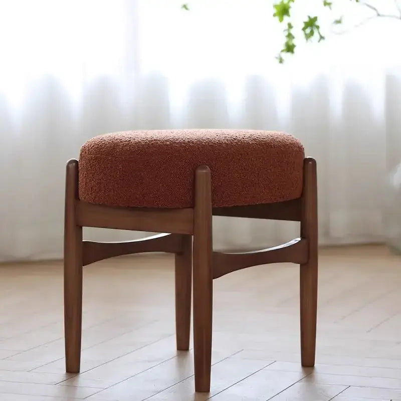 DecorBites ash wood makeup bench with rust-colored textured upholstered seat and sleek wooden legs for small spaces