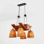 Rustic wooden chandelier light fixture with three woven wicker shades and brown tapered suspension chains by DecorBites Asia