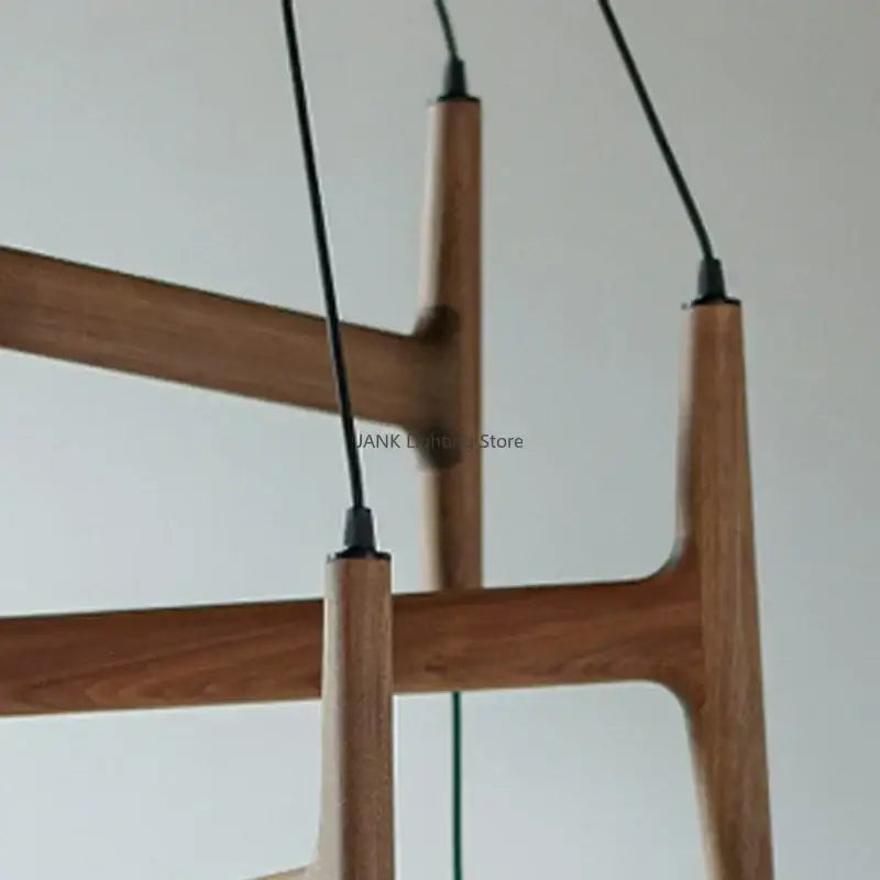 Modern wooden pendant light with sleek minimalist design and black cords from decorbites astra wood pendant series
