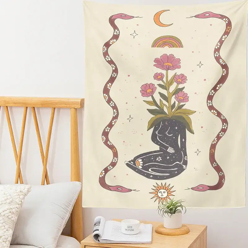 Cream-colored decorbites astrology tarot tapestry with black seated figure, pink flowers, maroon snakes, and celestial motifs wall hanging