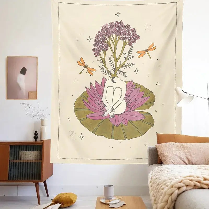 A cream-colored decorbites astrology tarot tapestry featuring a sun moon goddess seated on a pink lotus with flowers and dragonflies