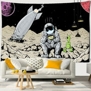 Black-and-white decorbites astronaut alien tapestry featuring cartoon astronaut alien and rocket on rocky planet surface