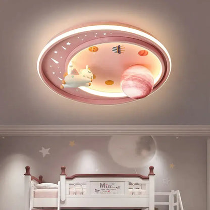 Pink oval ceiling light decorbites astronaut astros featuring a glowing planet and plush unicorn for child’s bedroom